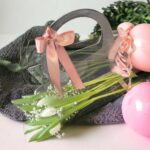 A hug with white tulips